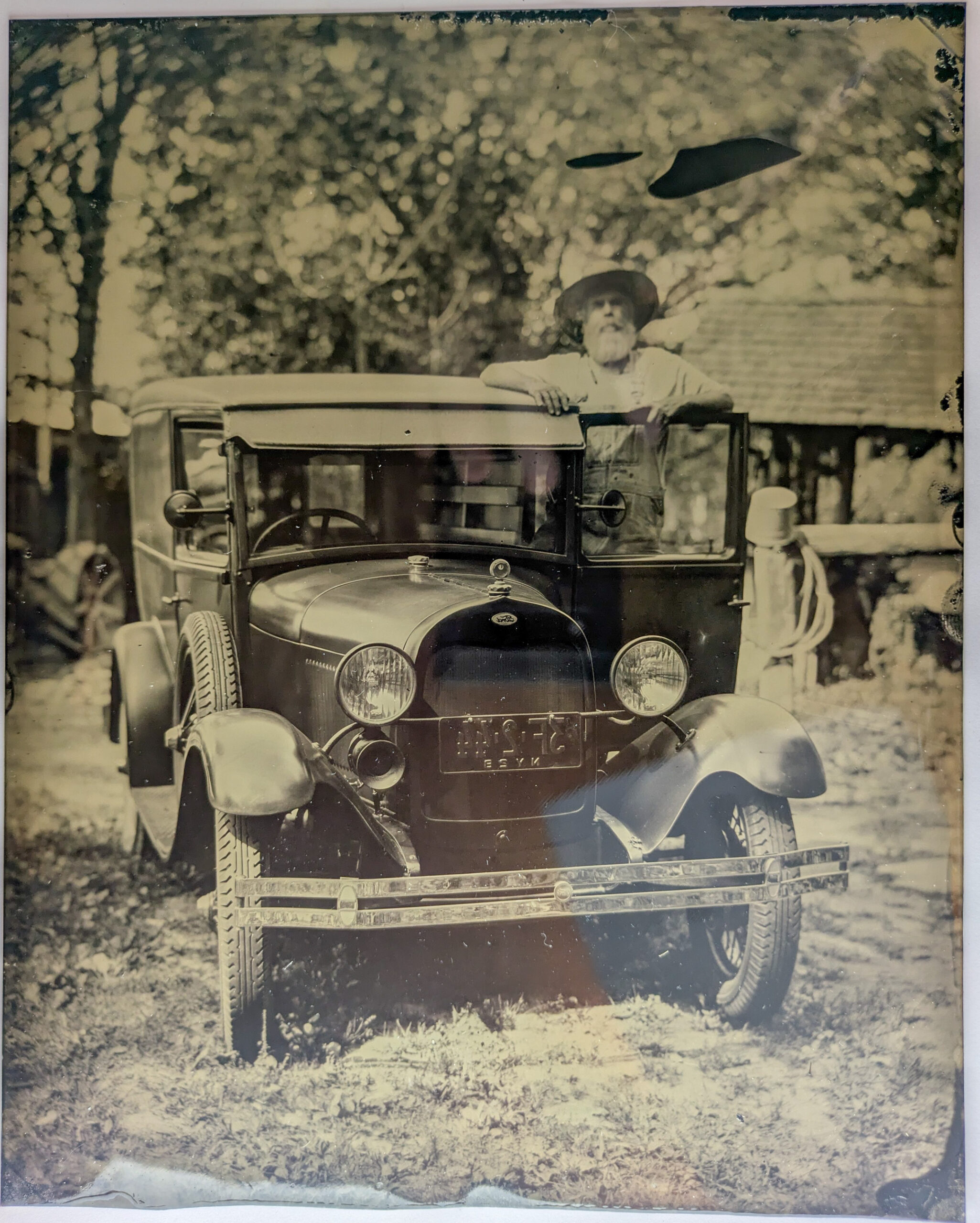 Tintype portrait with a classic automobile